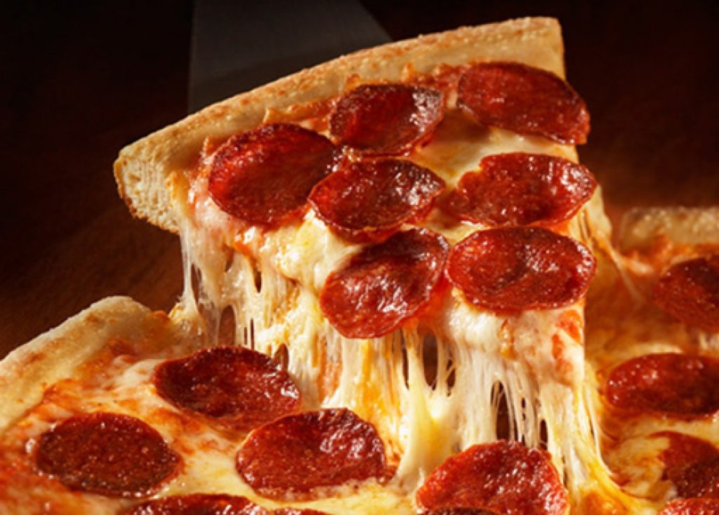 Pizza Near Indiana University of Pennsylvania - Pepperoni pizza slice dripping with cheese