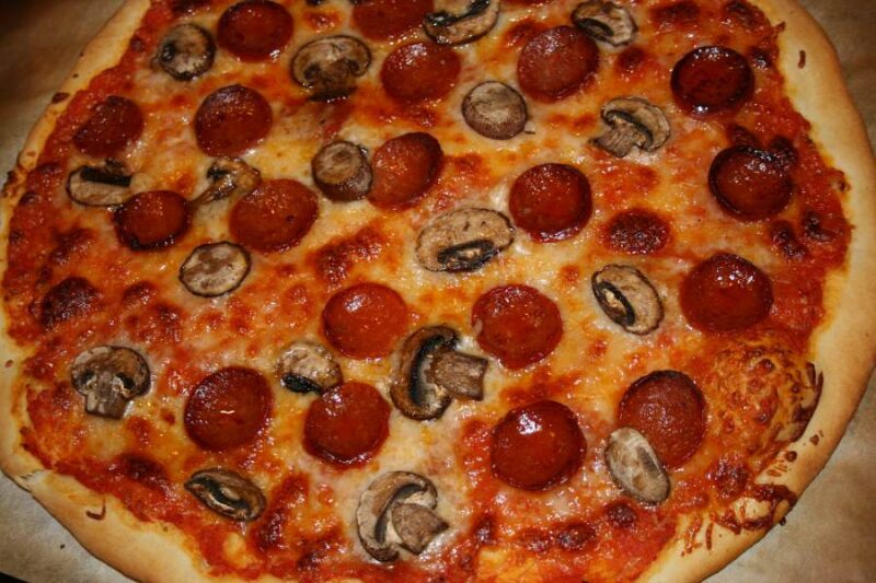 an image of a classic italian pepperoni and mushroom pizza it looks delicious, baked to perfection. Nummy!!