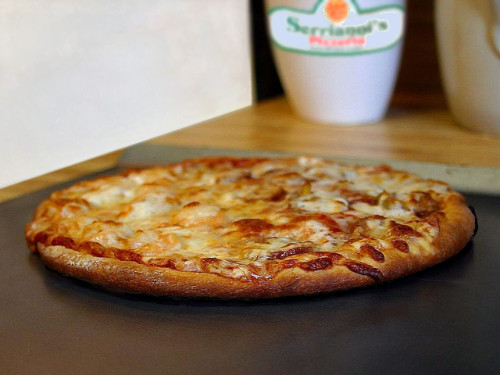 an image of a cheese pizza cooked to perfection with a lite browning of the cheese and a new york style crust. Looks really good!