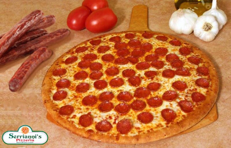 An image of a beautifull baked pepperoni pizza on a wooden cutting table, it's a wonderful sight l.o.l