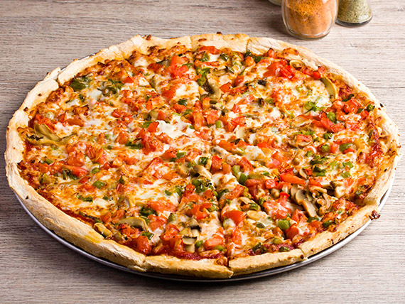 An Image of Large Deluxe Pizza with multiple toppings like sausage and pepperoni, tomatoes, black olives green peppers and more, it looks scrumptious! 