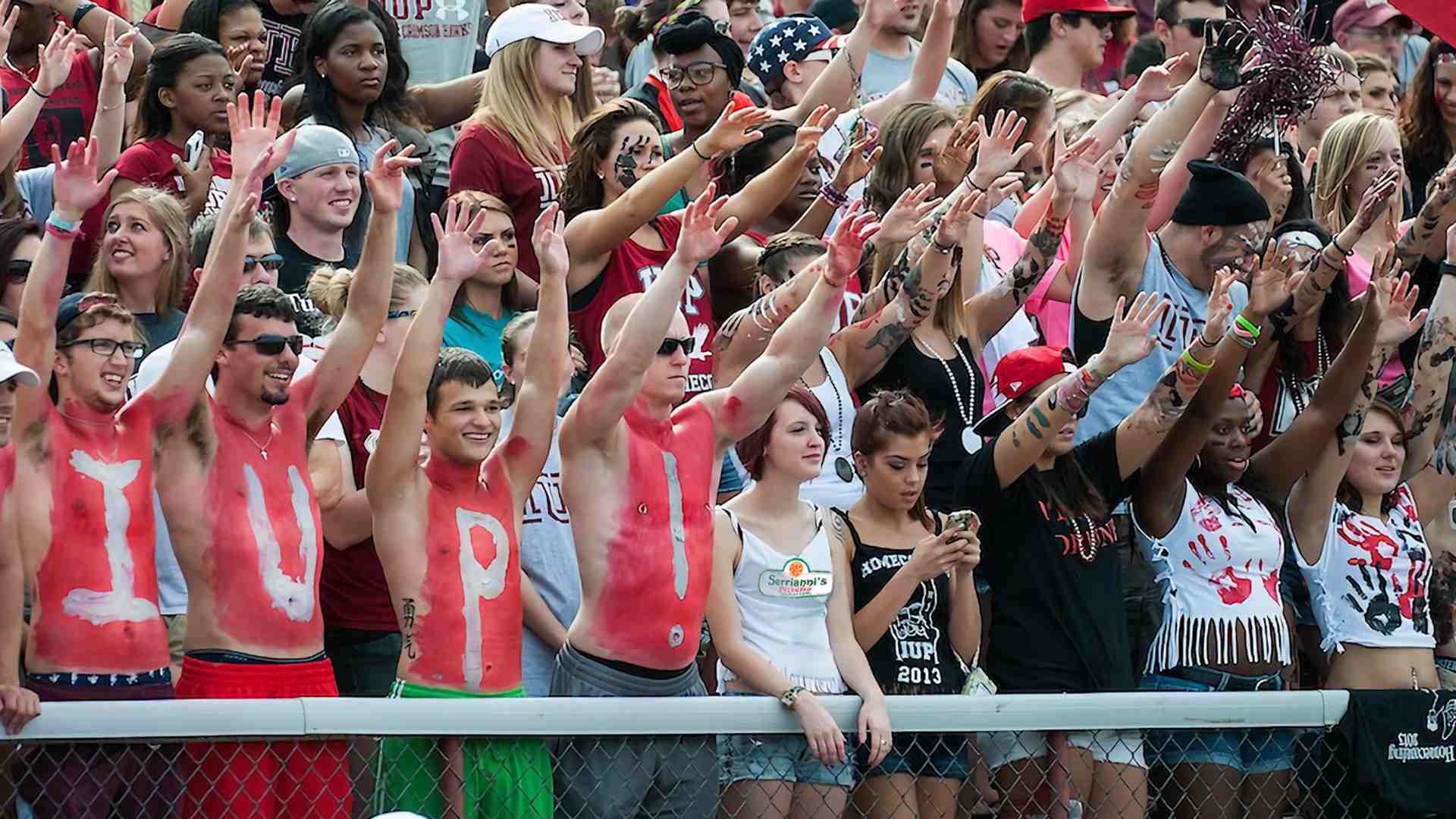 Indiana University of Pennsylvania students cheering for their football team, they all look very happy!