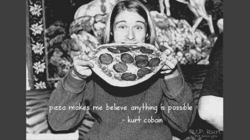 Black and white image of Kurt Cobain chomping on a whole pizza and text overlay of his quote "pizza makes me believe anything is possible"